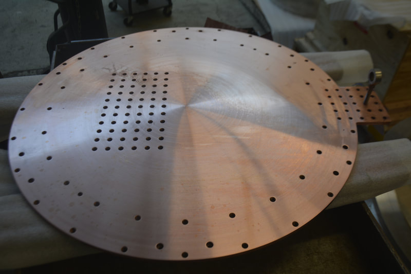The high thermal conductivity of C101 OFHC copper make it the ideal heat transfer medium. This plate is mechanically attached to a n aluminum cryogenic reservoir within a vacuum chamber. Infrared optics are mounted on it and kept at cryogenic operating temperatures. 