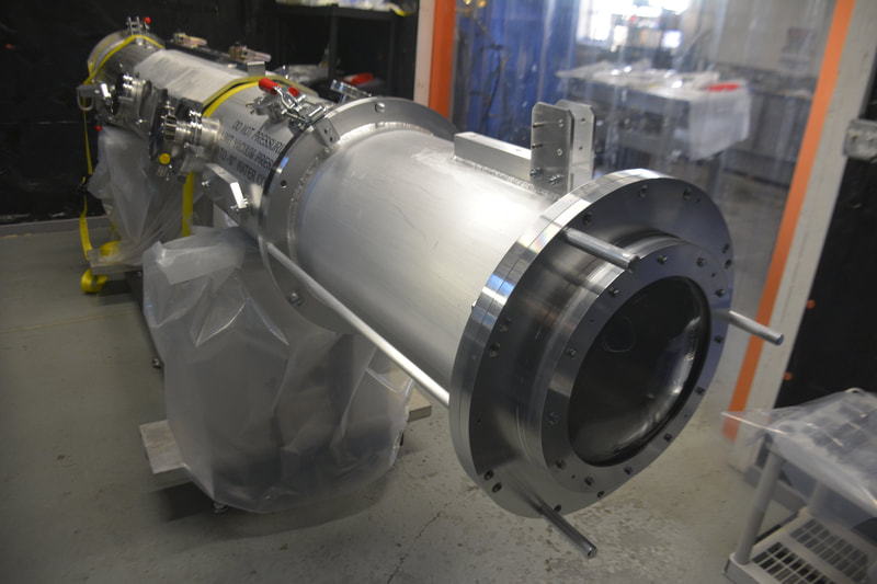 Large vacuum vessels can be used for processing and transporting samples.  Meyer Tool manufactured this large, multi-part custom stainless steel vacuum vessel for a DOE National Lab.  The UHV vacuum chamber was designed for processing samples in ultra-high vacuum then transporting them to a separate facility for analysis.