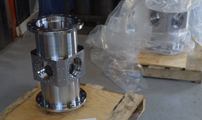Custom stainless steel reactor vessels with precision machined surfaces. Vessel machined from a single forged piece. 