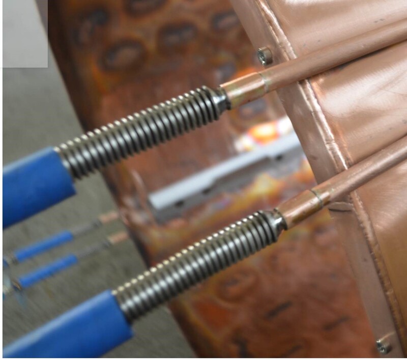 Copper Thermal Shield utilizes copper cooling tubing transitions to stainless steel flex hose and fittings for connection to cryogen supply. 