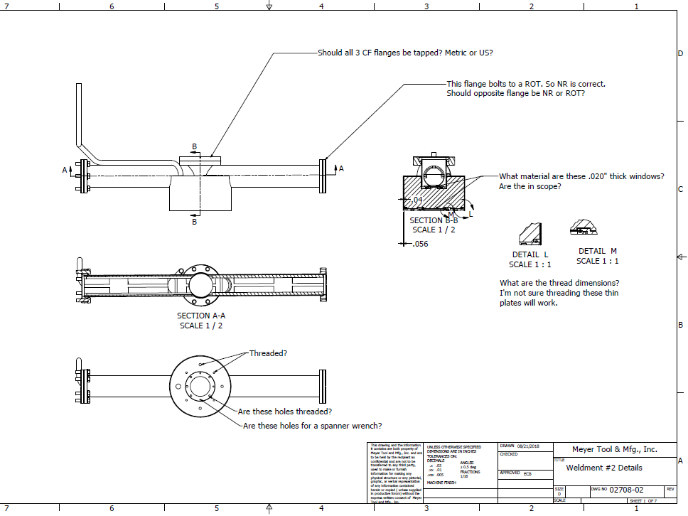 Engineers at Meyer Tool often mark up drawings to clarify design intent and suggest changes during the Discover and Design phases.  This drawing shows the overall titanium chamber assembly with notes to clarify features in the vacuum chamber design.