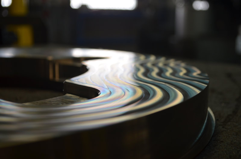 Finish machining on a custom stainless steel flange can leave beautiful patterns on the surface.  Meyer Tool's machinists have experience manufacturing to tight tolerances and strict surface finish requirements for ASME Section VIII and Section IX pressure and vacuum sealing surfaces.