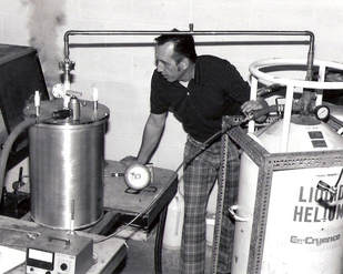 Meyer Tool founder Frank Meyer, performing a helium leak test on a custom vacuum chamber