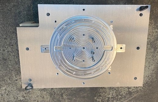 An aluminum sub-plate machined on and for the new VMX24i CNC mill will increase productivity of set ups. 