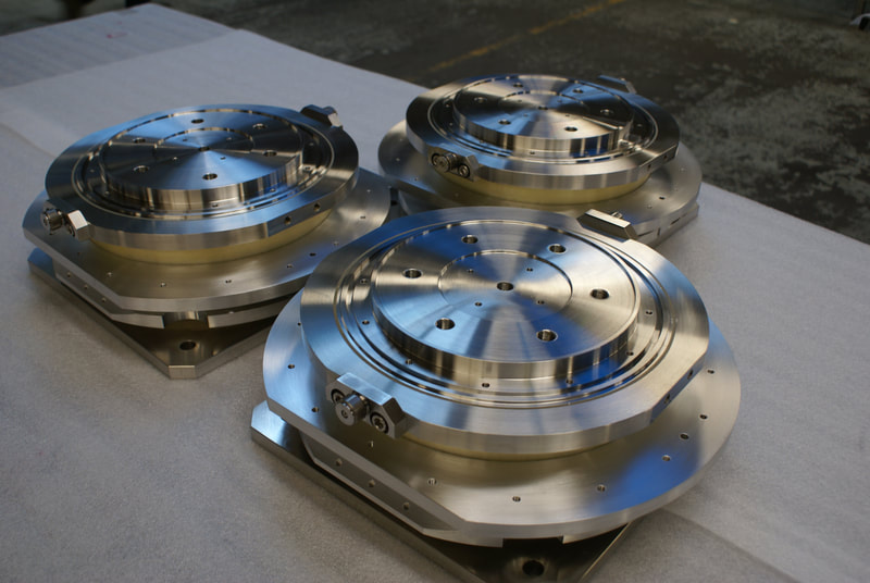 Vacuum flanges often require custom features to function properly for an experiment or ASME code vacuum process vessel.  The welded stainless steel UHV vacuum flanges pictured here were machined, welded and post-weld machined to create complex internal features.