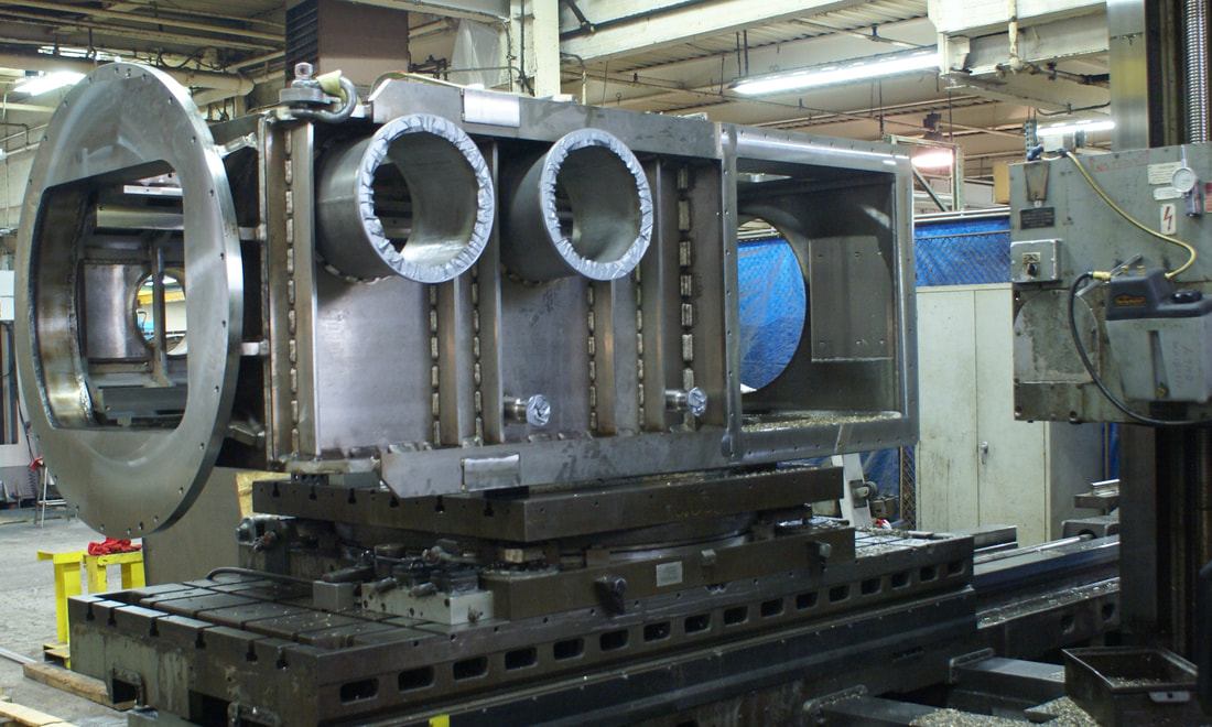 Post Weld Machining of a large stainless steel vacuum vessel designed to withstand seismic loads.