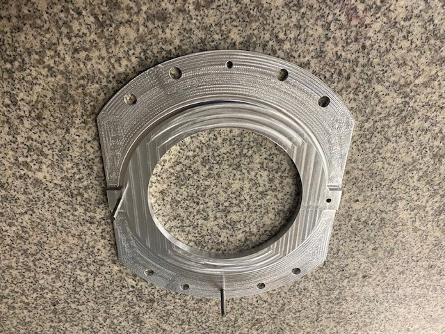 An aluminum 35-50K RIng for a Cryomodule Low Heat Leak Support Post for Fermilab is the first production part machined on the new Hurco VMX24i. 